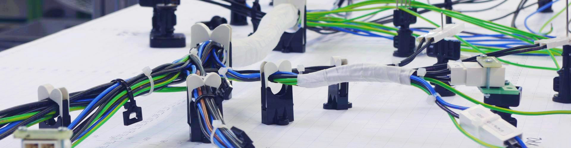 Global site networking in wire harness production